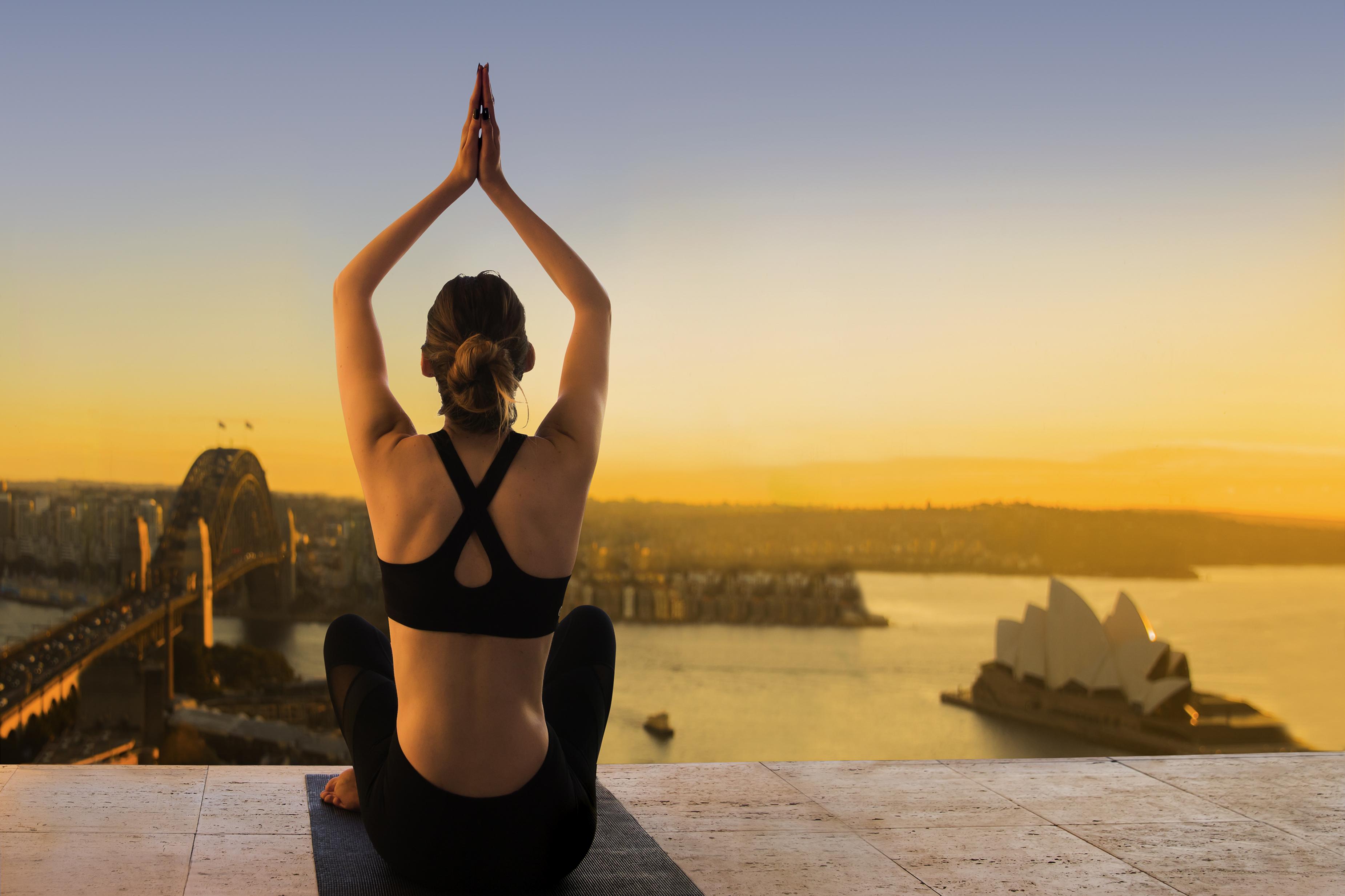 The Sebel Quay West Suites Сидни Екстериор снимка A woman practicing yoga at the Sydney Opera House